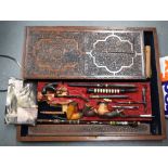 AN ANTIQUE BAGARD BOX “MONTAGUE FAMILY”, containing a collection of pipes. Box 56 cm x 68 ccm. (qty