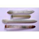 FOUR EARLY 20TH CENTURY CHINESE JADE HAIR SLIDES. Largest 12 cm long. (4)