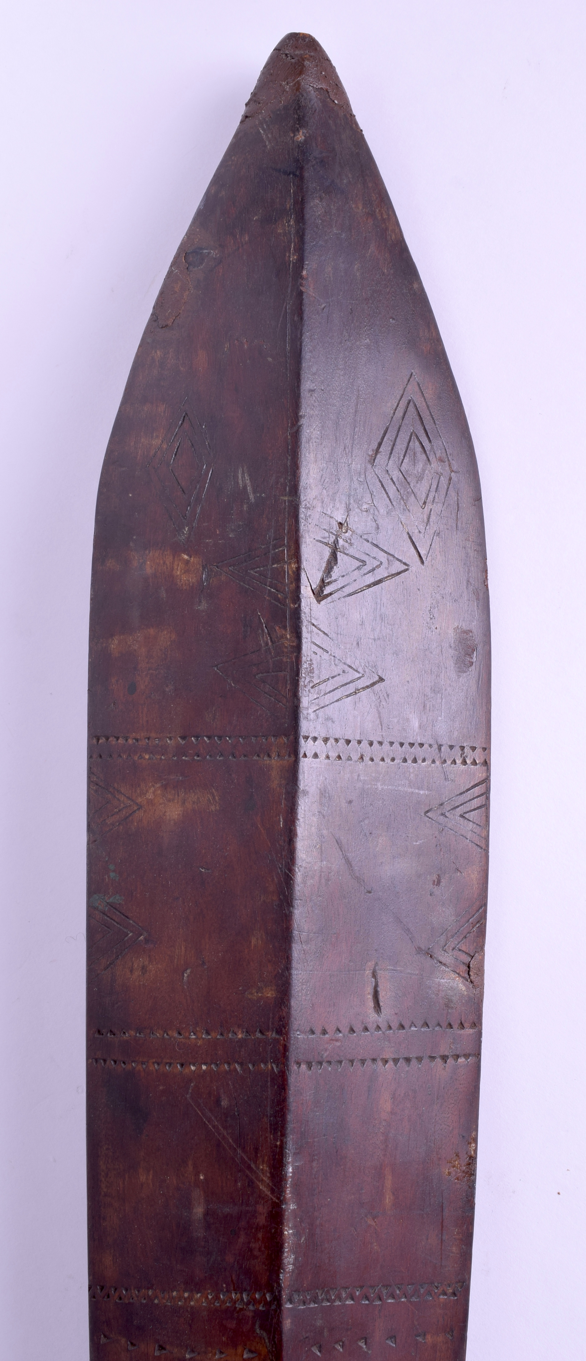 A 19TH CENTURY POLYNESIAN SOUTHSEA ISLANDS TRIBAL WOOD CLUB decorated with arrow head motifs. 129 c