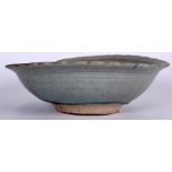 A LARGE 15TH CENTURY CHINESE MING DYNASTY CELADON POTTERY BOWL, incised with foliage. 28.5 cm wide.