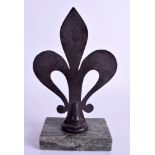 A bronze fleur de lys and green marble presse papier. 20cm high.