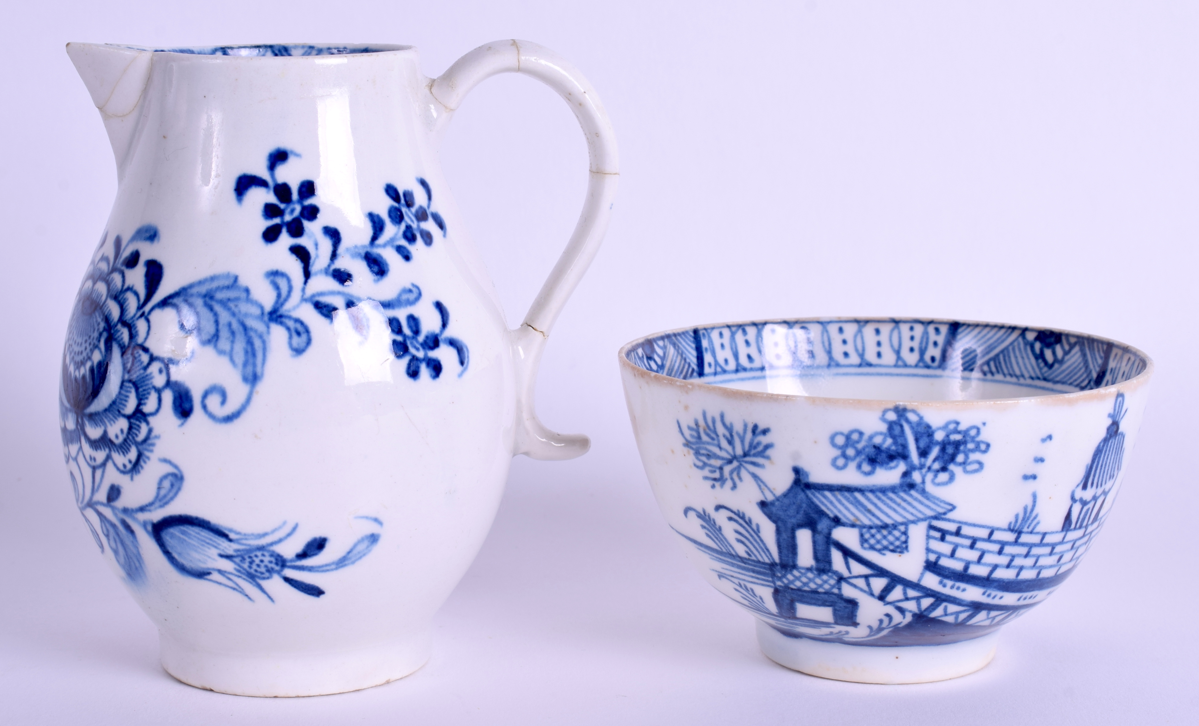 AN 18TH CENTURY LIVERPOOL BLUE AND WHITE SPARROWBEAK JUG together with an English porcelain teabowl