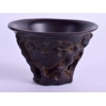 A RARE CHINESE QING DYNASTY MINIATURE CARVED WOOD LIBATION CUP of miniature form. 6 cm x 5 cm.