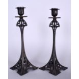 A GOOD PAIR OF WMF ART NOUVEAU PEWTER CANDLESTICKS, stamped to to base. 28 cm high.