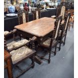 A 19TH CENTURY GERMAN OAK TABLE AND SIX CHAIRS, carved with lion mask heads and fish base form base