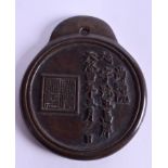 AN UNUSUAL 19TH CENTURY CHINESE BRONZE MEDALLION decorated with calligraphy. 10 cm x 11.75 cm.