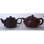 A CHINESE YIXING OR ZISHA POTTERY TEA POT, together with another example. 14.5 cm wide & 14 cm wid