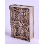 A MINIATURE SILVER FILIGREE BOX, in the form of a book. 4 cm x 3 cm.