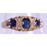 AN 18CT GOLD AND SAPPHIRE RING. 2.6 grams. Size O.