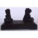 A PAIR OF 20TH CENTURY CHINESE BRONZE MYTHICAL BEASTS, mounted upon wooden plinth. 20 cm wide.