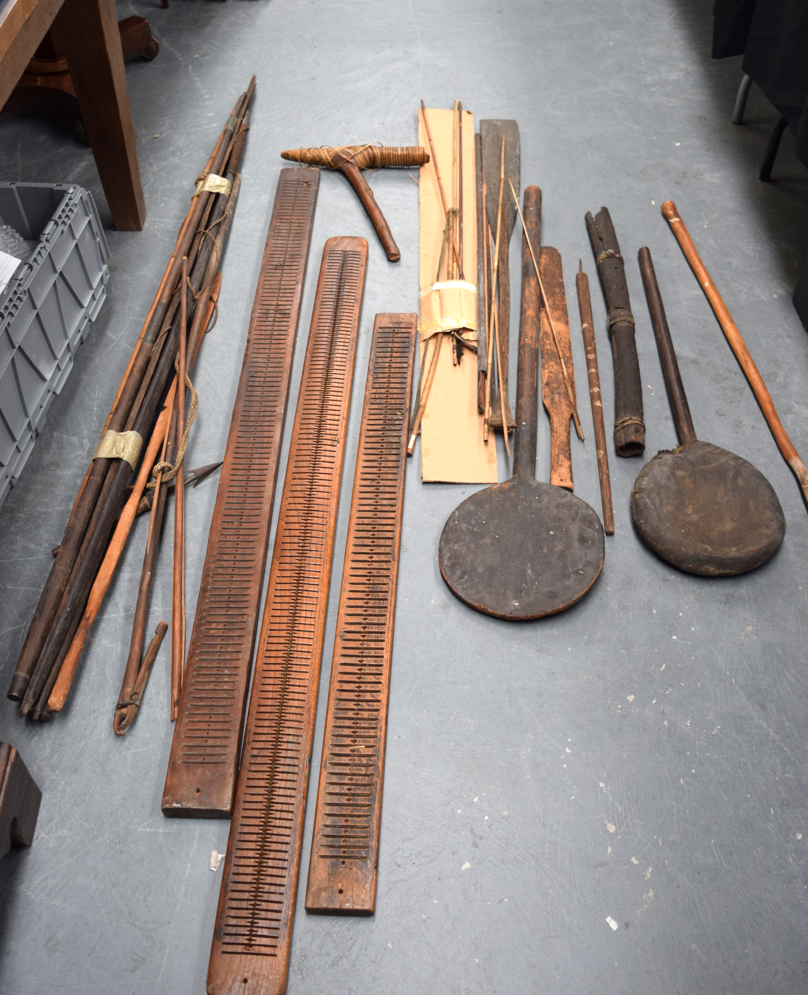 A COLLECTION OF ANTIQUE TRIBAL WEAPONS AND OTHER ARTICLES, spears, arrows etc, some bearing old lab