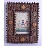 A Black Forest pine cone and twig encrusted novelty picture frame, c. 1900, 25 x 18cm.