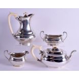 AN ART DECO SILVER AND IVORY FOUR PIECE OVAL SILVER TEASET with ivory handles. London 1936/7. 59 oz