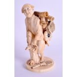 A 19TH CENTURY JAPANESE MEIJI PERIOD CARVED IVORY BASKET SELLER. 17 cm high.