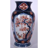 AN EARLY 20TH CENTURY JAPANESE IMARI PORCELAIN VASE, painted with panels of birds in landscapes, Me