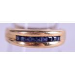 AN 18CT GOLD SAPPHIRE INSET RING, formed with sectional strip inlaid decoration. Size O & weight 4