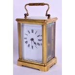 A LEATHER CASED FRENCH BRASS CARRIAGE CLOCK. 17 cm high inc table.