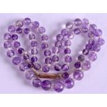 A 9CT GOLD MOUNT AMETHYST BEAD NECKLACE, formed with rock crystal spacers. 46 cm long.