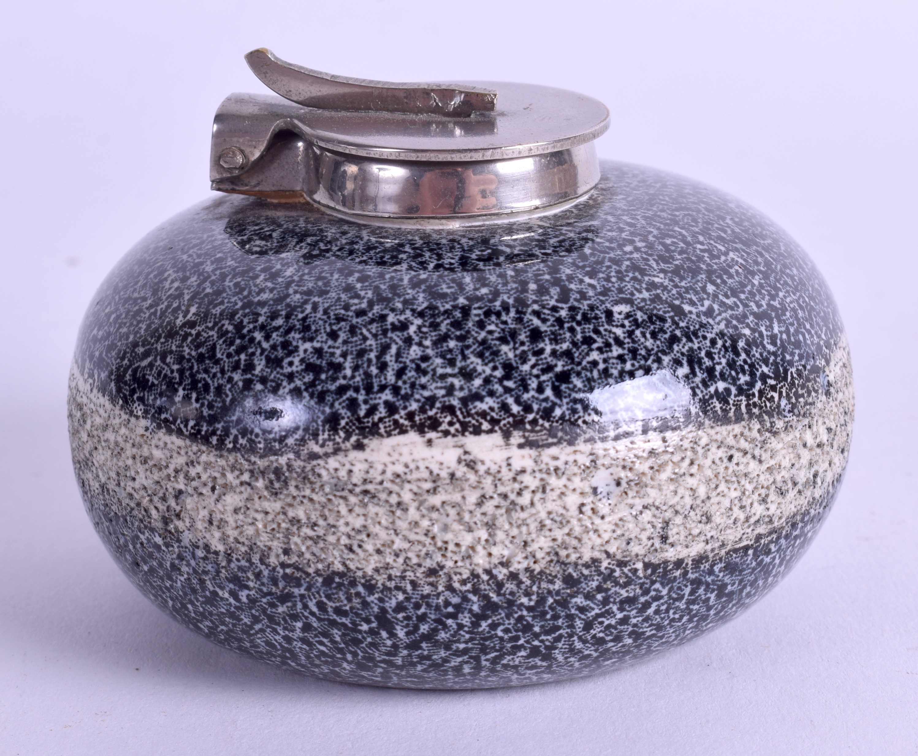 A miniature curling stone inkwell, the coloured ceramic body with a hinged nickel mount, Scottish,