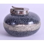A miniature curling stone inkwell, the coloured ceramic body with a hinged nickel mount, Scottish,