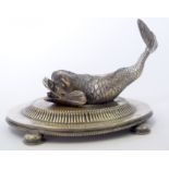 A SILVER PLATED FISH ON STAND, possibly a pepperette. 15.5 cm wide.