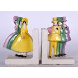 A PAIR OF ART DECO PORCELAIN BOOKENDS, in the form of standing males and females, European. 13 cm h