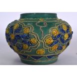 A CHINESE MING STYLE GREEN GLAZED POTTERY GUAN SHAPED VASE, decorated in relief with foliage. 25 cm