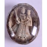 A 19TH CENTURY CARVED RELIQUARY, in the form of a female holding a child. 5.5 cm x 4.5 cm.