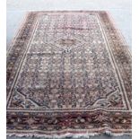 AN EARLY 20TH CENTURY BEIGE GROUND HAMADAN RUG, decorated with extensive foliage. 322 cm x 205 cm.