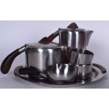 A STYLISH STAINLESS STEEL DANISH LUNDTOFT TEA SET, formed with wooden handles and finials. Tray 35