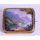 A SWISS GOLD ENAMEL BROOCH, decorated with a mountainous landscape. 2.9 cm x 3.5 cm.