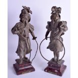 A PAIR OF ANTIQUE FRENCH SPELTER FIGURES OF GIRLS. 37 cm high.