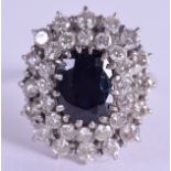 AN 18CT GOLD DIAMOND AND SAPPHIRE CLUSTER RING. 8.1 grams. Size R.