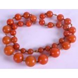 A BAKELITE SPHERICAL BEAD NECKLACE, imitating amber. 56 cm long.