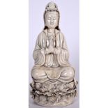 A CHINESE DEHUA BLANC DE CHINE PORCELAIN FUGURE OF GUANYIN, formed seated in a meditative state. 28