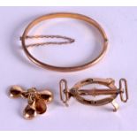 A 14CT GOLD CHILD'S BANGLE, together with two other articles. Total weight 9 grams. (3)