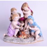 A 19TH CENTURY MEISSEN PORCELAIN FIGURE OF FOUR CHILDREN modelled beside a fire. 18 cm x 18 cm.