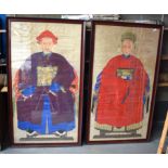 A PAIR OF 19TH CENTURY CHINESE FRAMED ANCESTRAL WATERCOLOURS modelled in brightly embellished robes