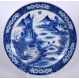 A 20TH CENTURY CHINESE BLUE AND WHITE PORCELAIN DISH BEARING KANGXI MARKS, decorated with landscape