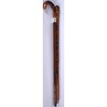 AN EARLY 20TH CENTURY SWORD STICK, together with another example carved with a snake. 92 cm. (2)