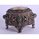 AN ANTIQUE CONTINENTAL SILVER ENAMEL AND JADE BOX AND COVER painted with two figures within a lands