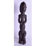 A LARGE AFRICAN TRIBAL HARDWOOD AND BRASS FERTILITY FIGURE. 50 cm high.