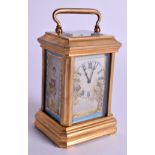 A MINIATURE PORCELAIN CARRIAGE CLOCK. 9 cm high inc handle.