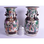 A PAIR OF 19TH CENTURY CHINESE CRACKLE GLAZED FAMILLE VERTE VASES painted with figures within a lan