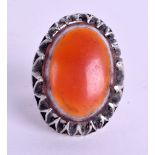 A CENTRAL ASIAN SILVER AND AGATE RING. Size V.