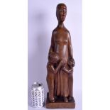 A STYLISH 1950S CARVED EUROPEAN WOOD FIGURE OF A FEMALE possibly Austrian, modelled beside two chil