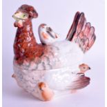 AN EARLY 19TH CENTURY ENGLUSH POTTERY HEN BOX AND COVER modelled with various chicks. 22 cm x 18 cm