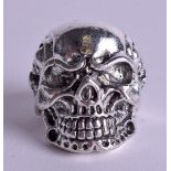 A SILVER SKULL RING. Size X.