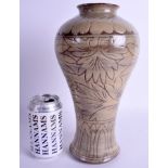 A CHINESE INCISED POTTERY VASE. 29 cm high.