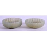 A PAIR OF 19TH CENTURY CHINESE JADE BOWLS. 6.5 cm wide.